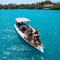 Guests relaxing on a private boat rental near Rosario Islands - Juan Ballena