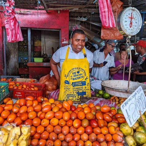 Vibrant stalls at Bazurto Market with fresh produce and spices